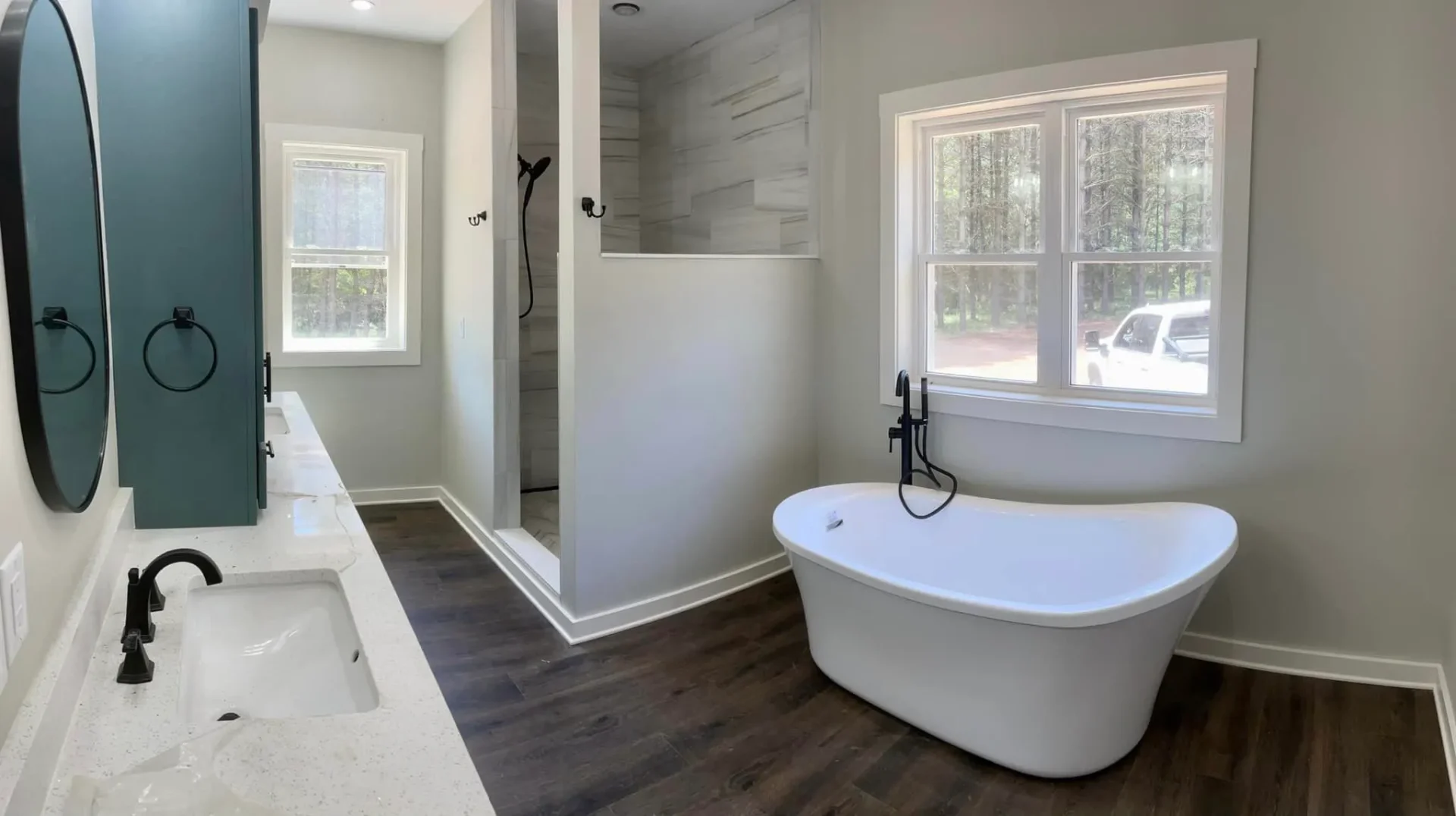 Modern bathroom with shiplap accent wall and freestanding tub