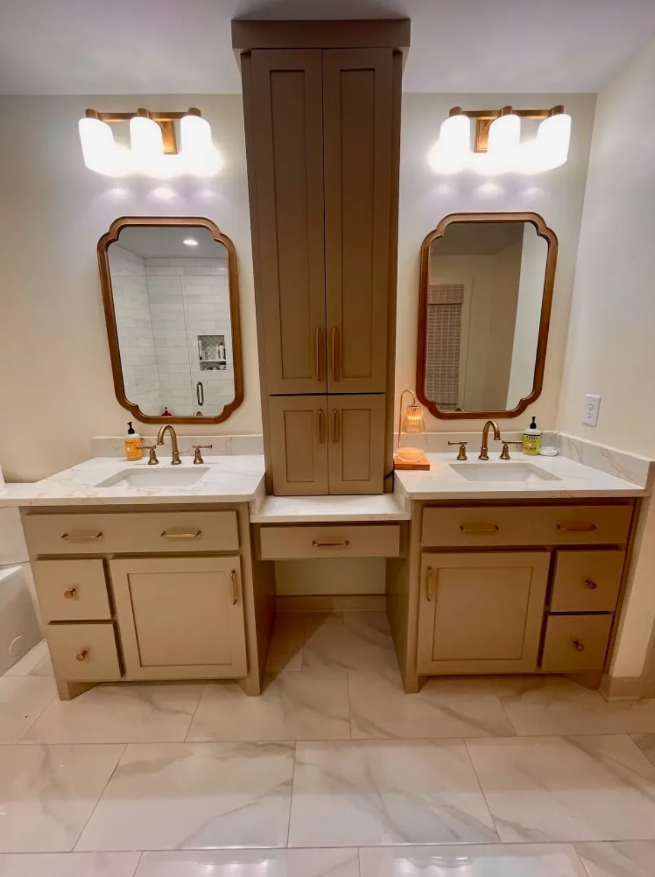 Master bathroom with dual vanities and wood storage tower