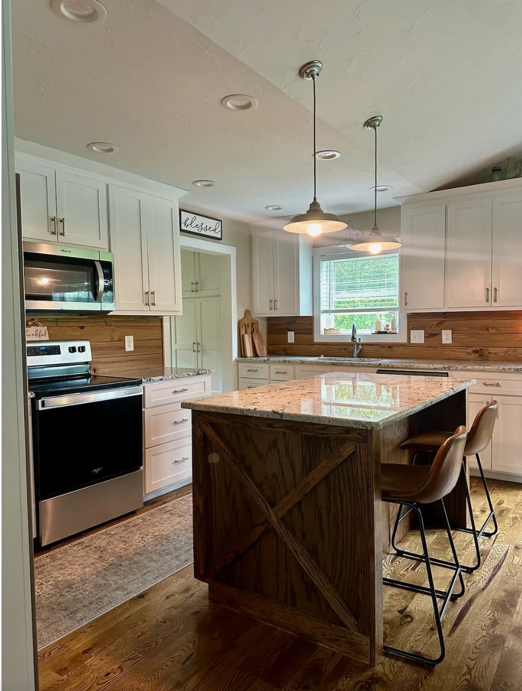 Rustic kitchen with wood island and granite countertops