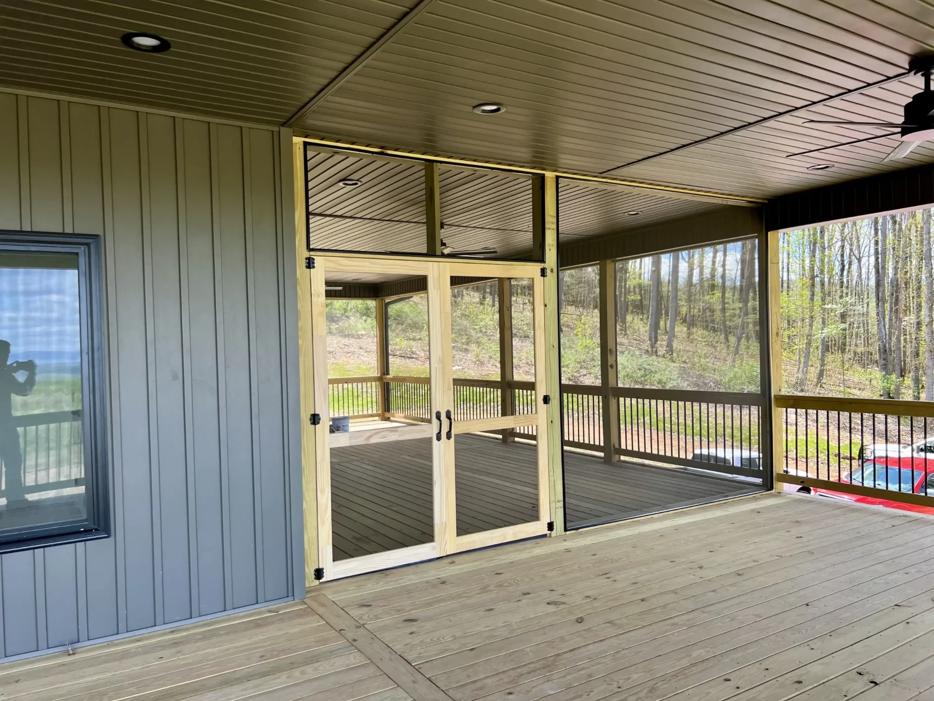 Welborn home outdoor living space with covered porch and mountain views