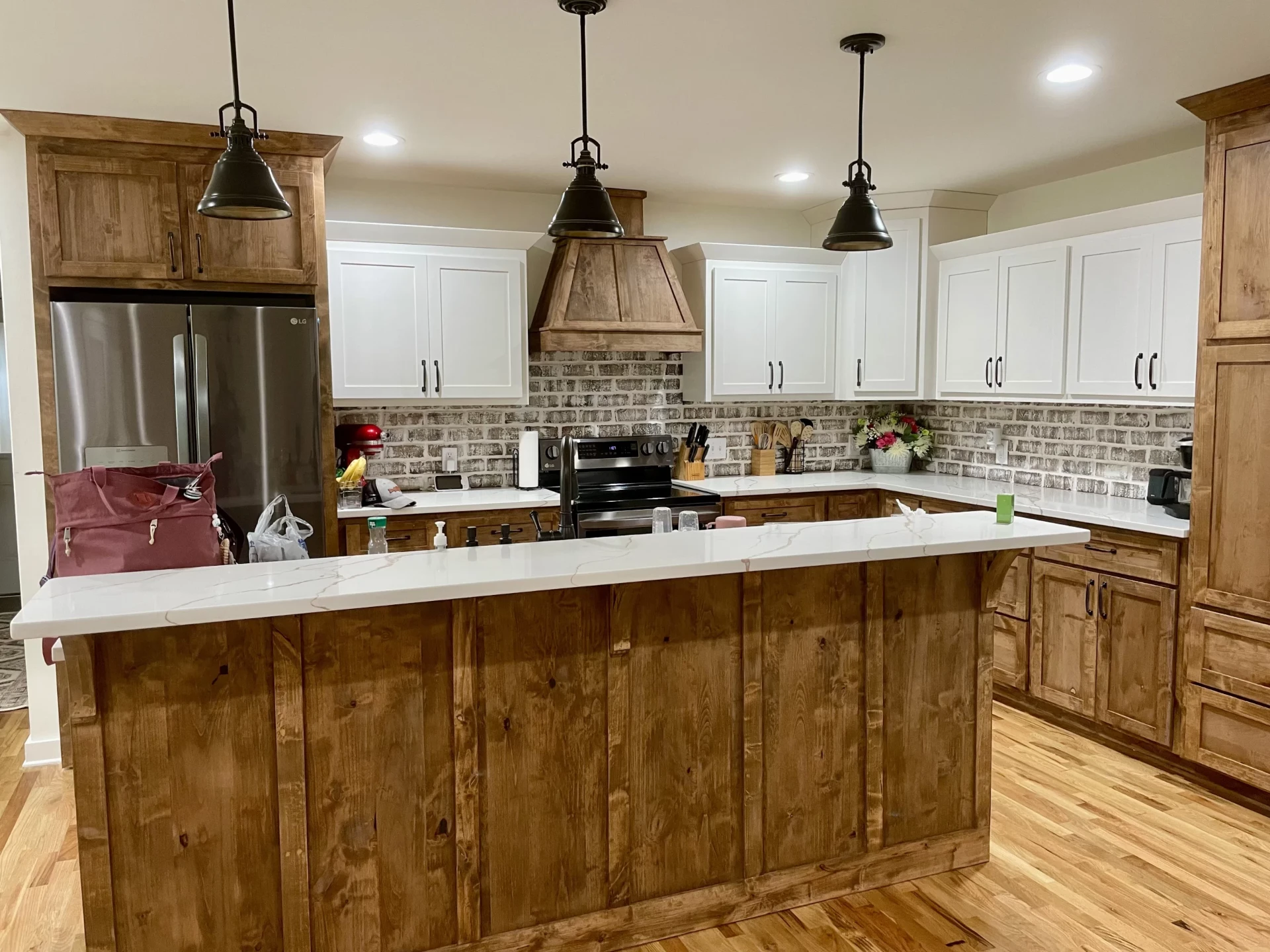 Brooks custom home living area with stone fireplace and vaulted ceilings