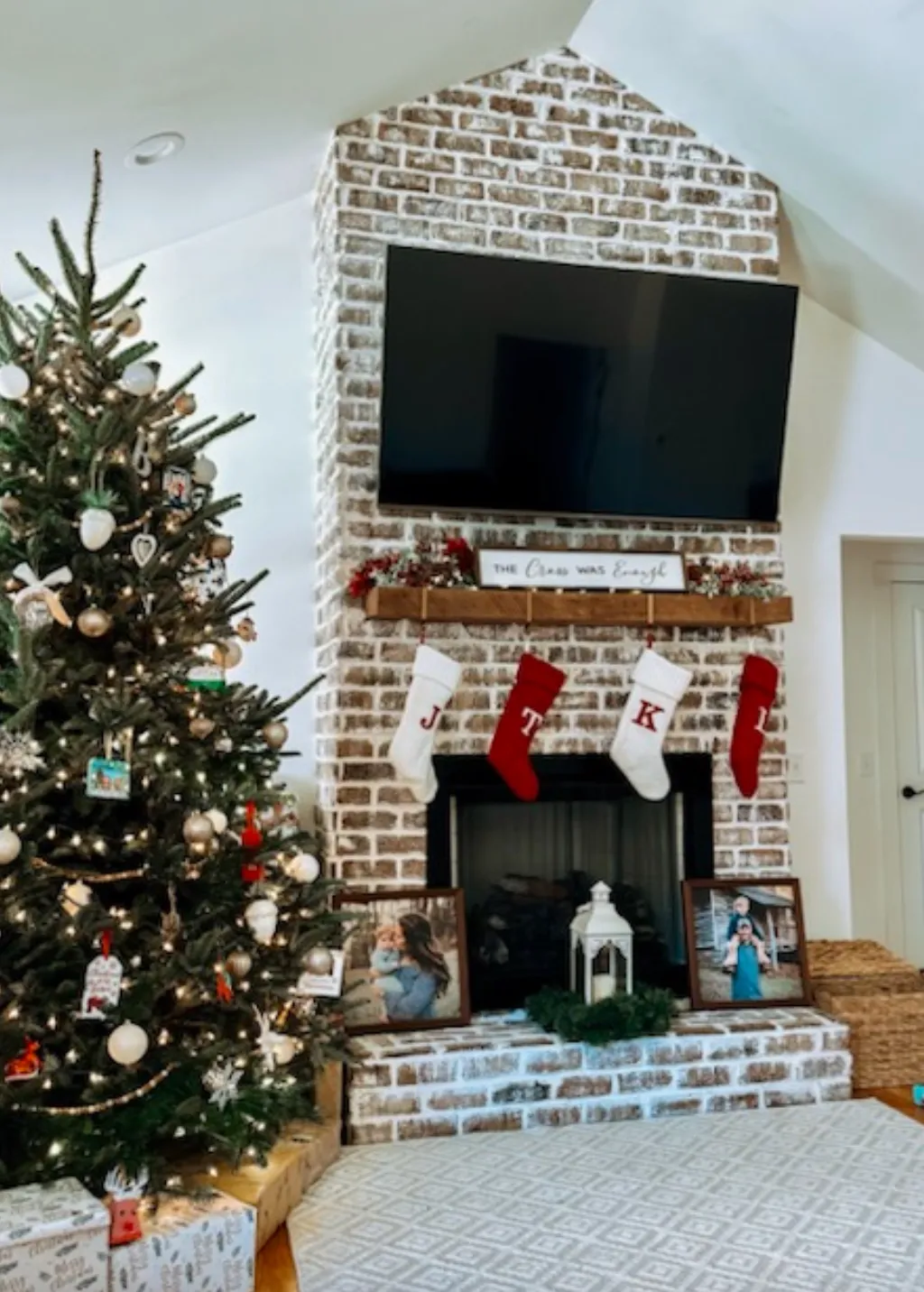 Traditional brick fireplace with Christmas stockings and holiday decor
