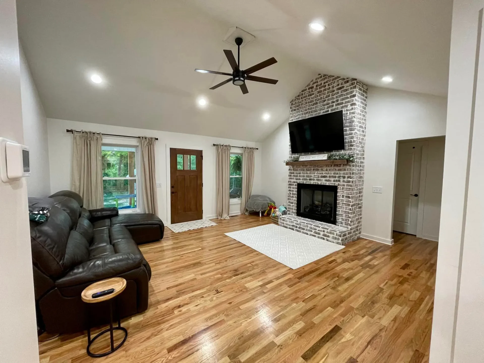Modern brick fireplace in open concept living room