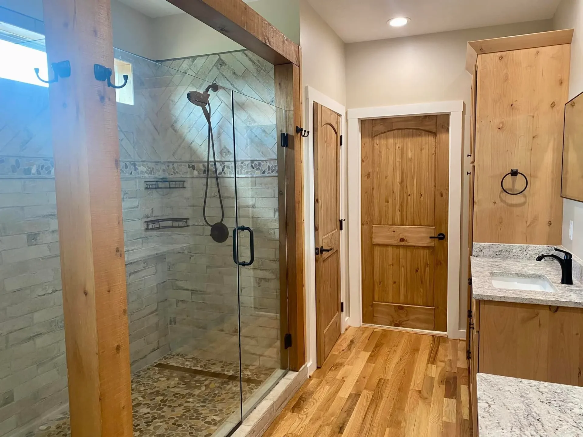 Rustic bathroom with natural stone shower and wood accents