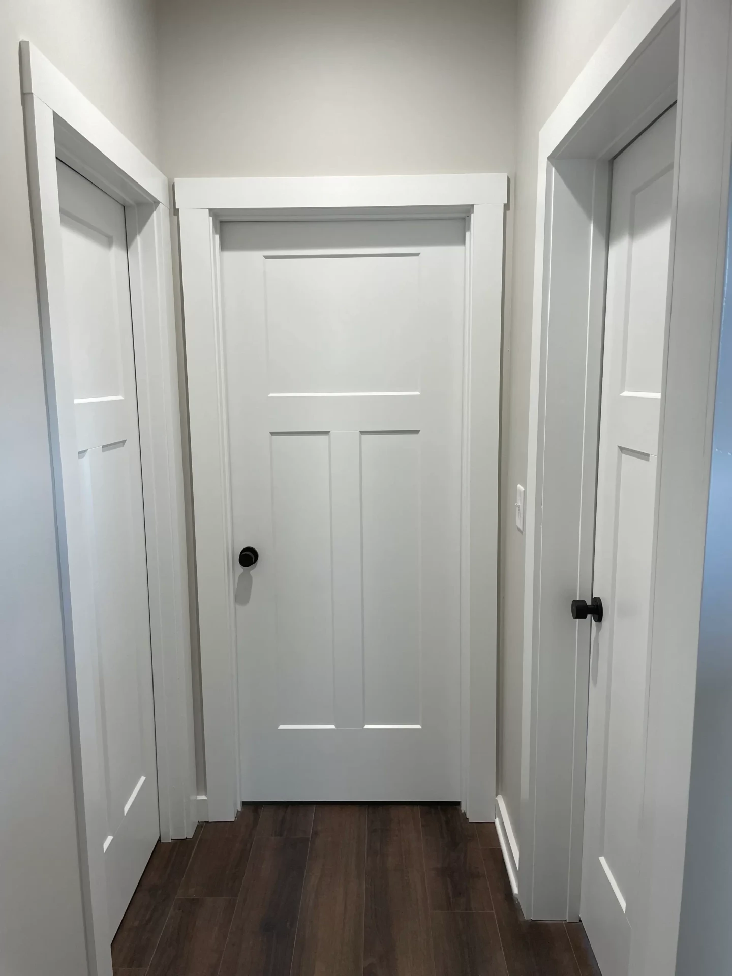 Clean white interior doors in modern hallway