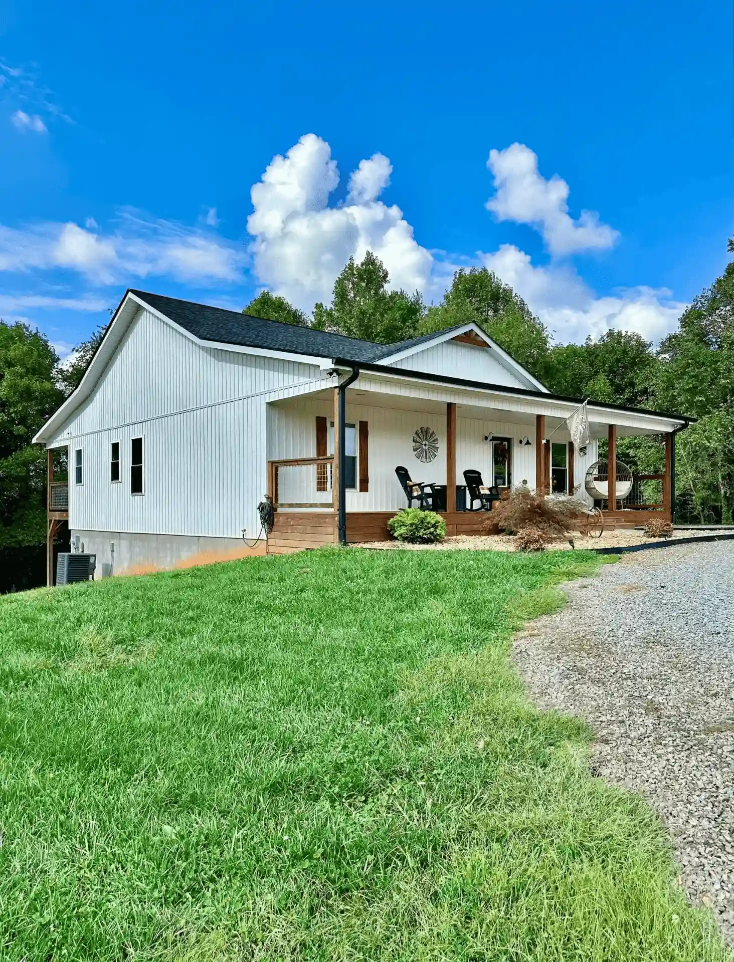 Eco-friendly sustainable home with white siding and wood accents
