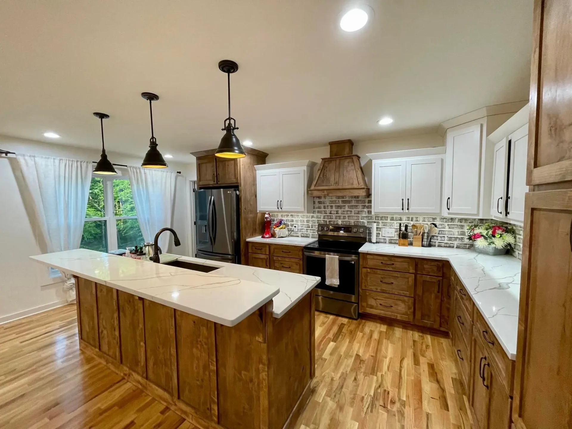 Traditional kitchen with white and wood cabinetry