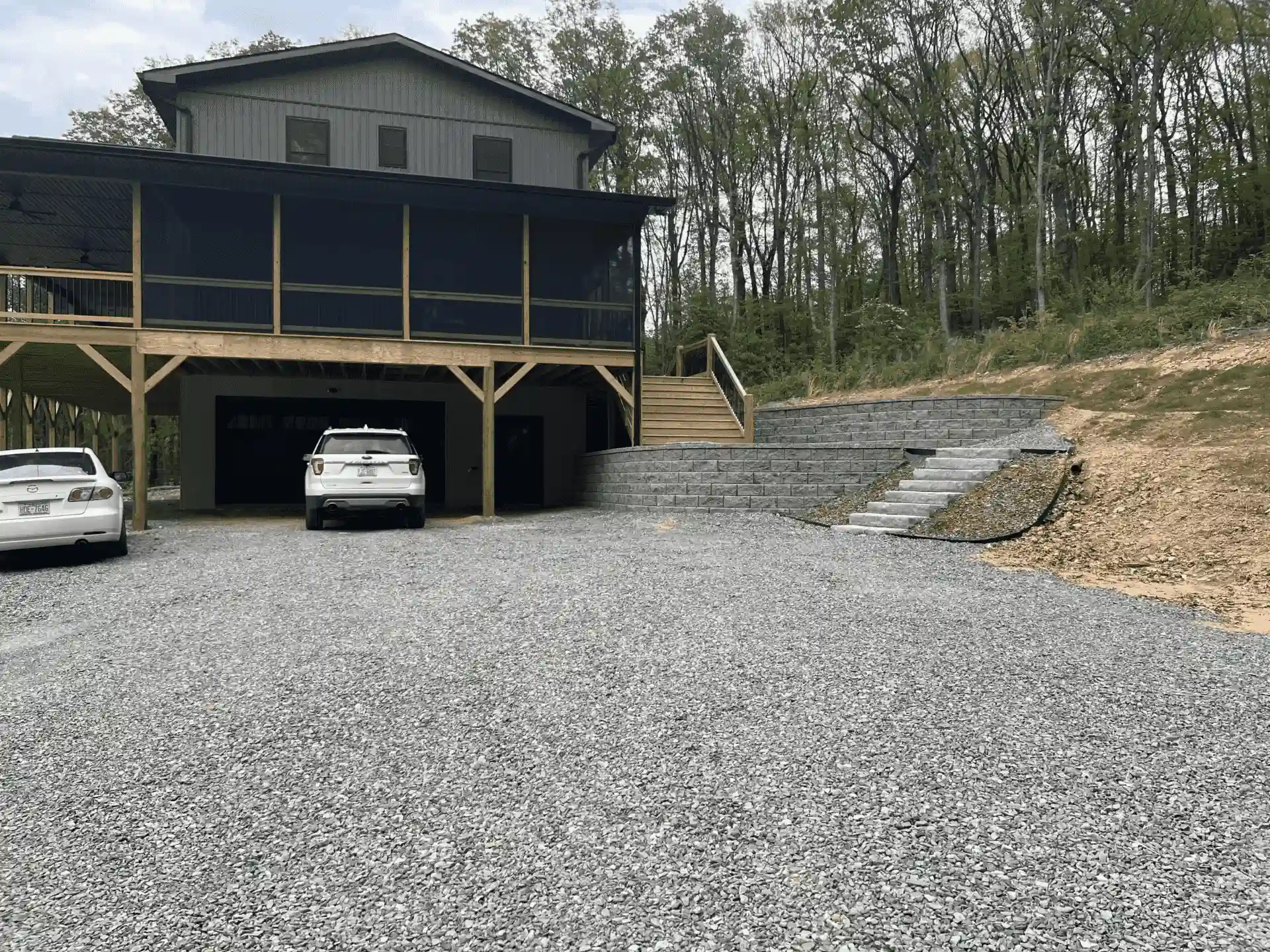 Welborn custom home exterior with stone and siding construction in mountain setting