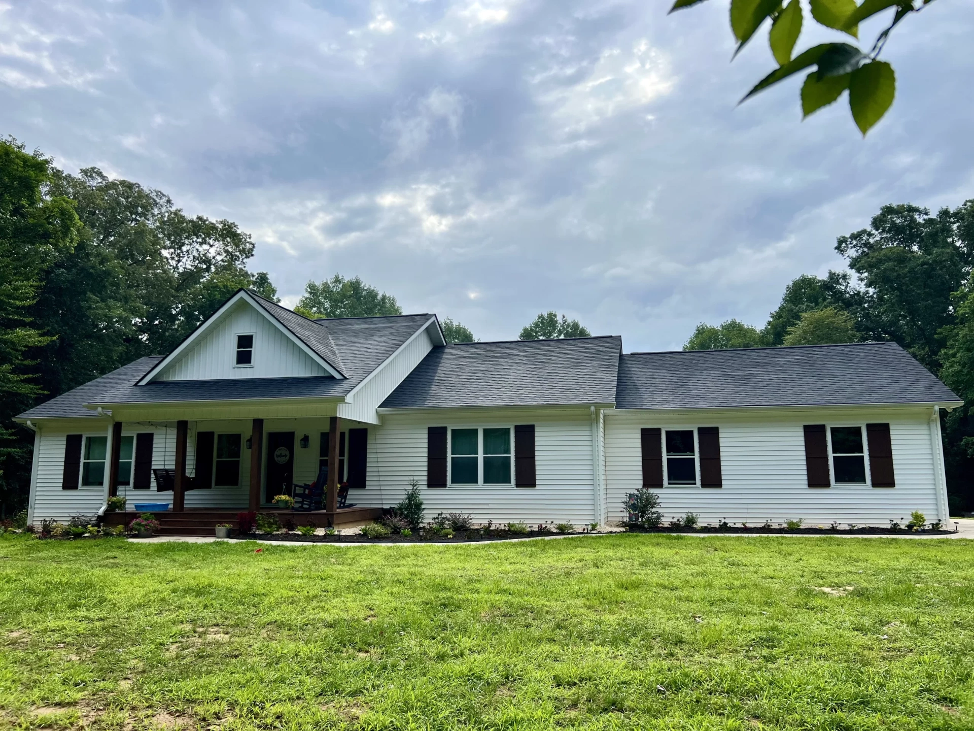 Brooks custom home exterior featuring modern architecture and stone accents