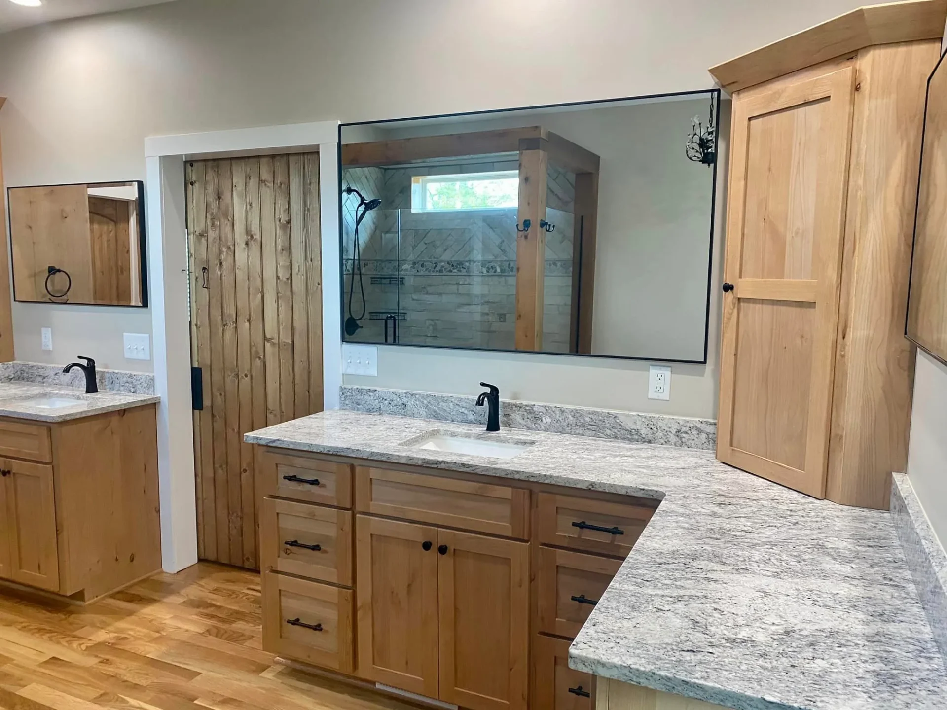 Master bathroom with rustic wood vanity and granite countertops