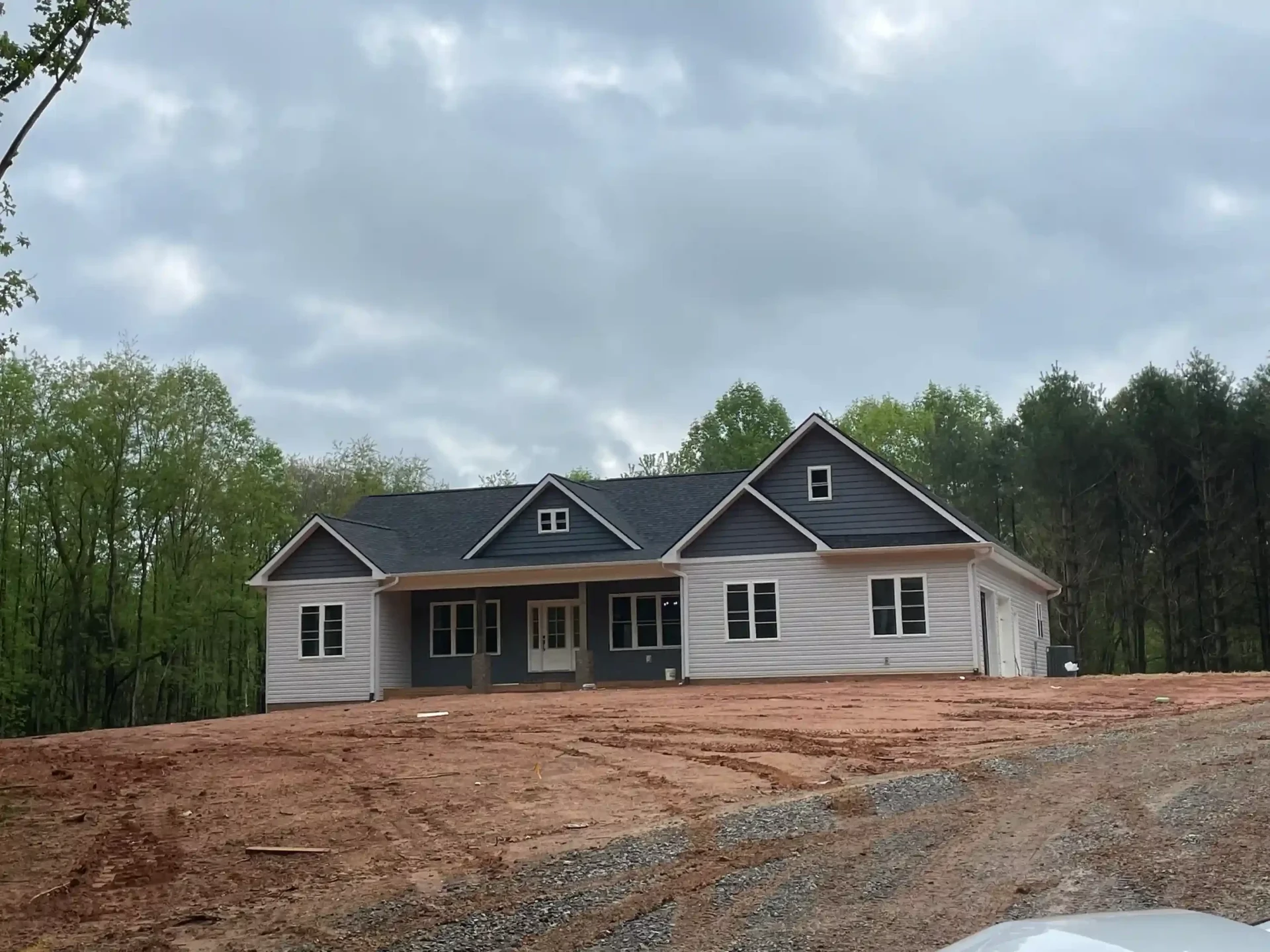 Bell custom home exterior featuring modern architecture and stone construction